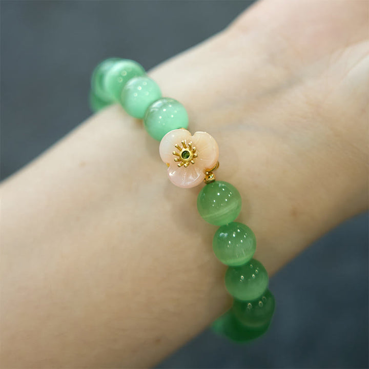 Pulsera de amor con flor de crisoberilo y ojo de gato con Buddha Stones