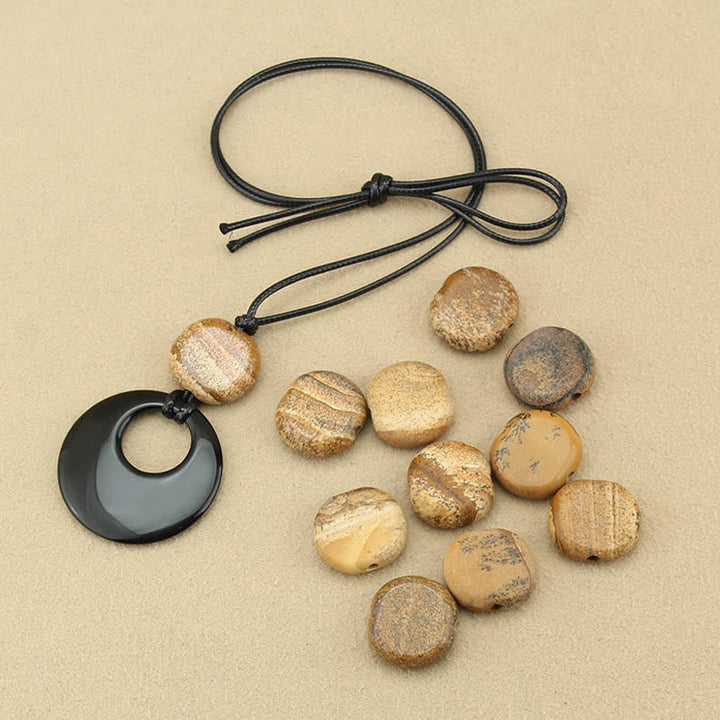 Collar con colgante de cobre con imagen de piedra de Liuli y obsidiana negra de Buddha Stones