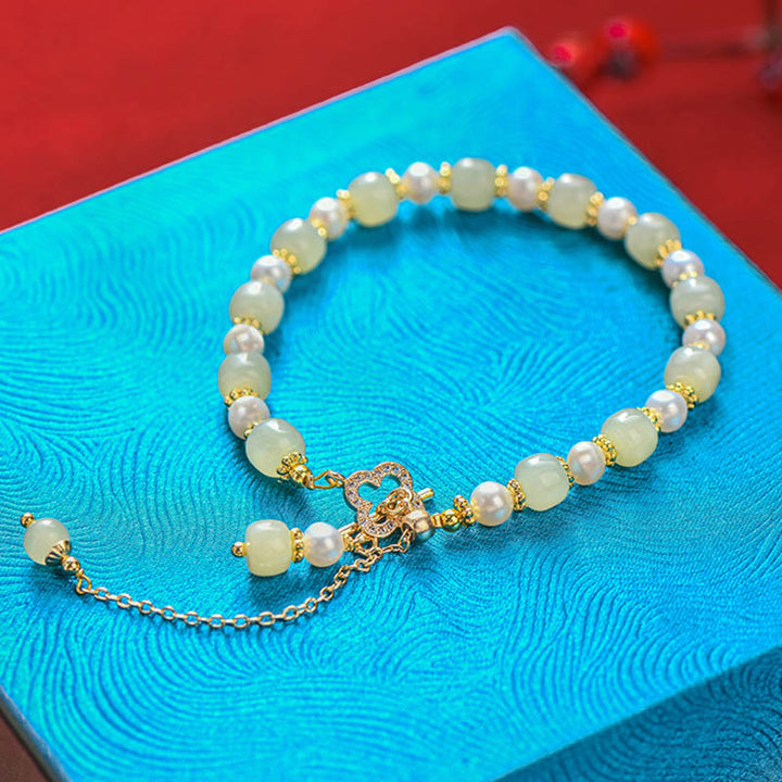 Pulsera de la abundancia con colgante de trébol de cuatro hojas de aleación de perla de jade hetiano y Buddha Stones