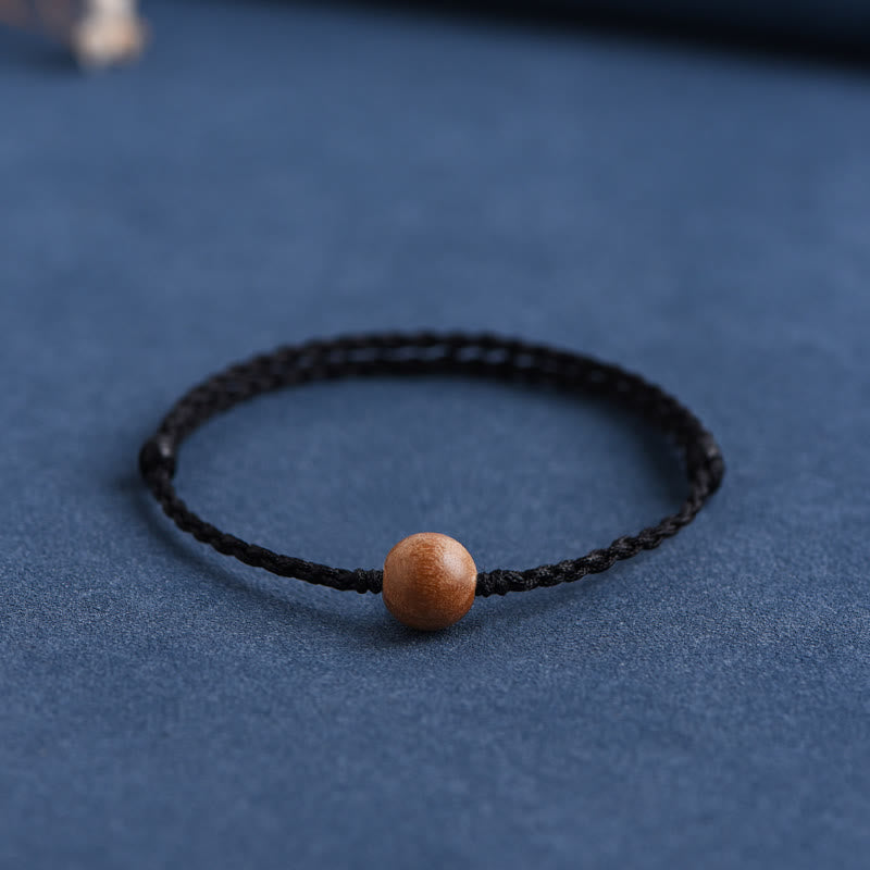 Pulsera trenzada con cuentas de madera de melocotón natural y Buddha Stones que alejan a los malos espíritus