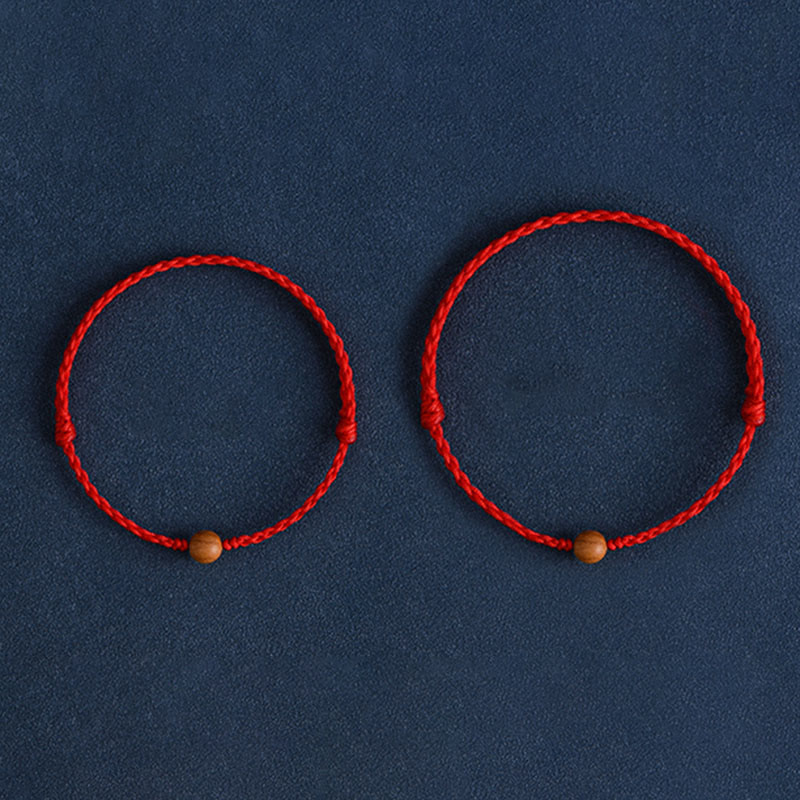 Pulsera trenzada con cuentas de madera de melocotón natural y Buddha Stones que alejan a los malos espíritus