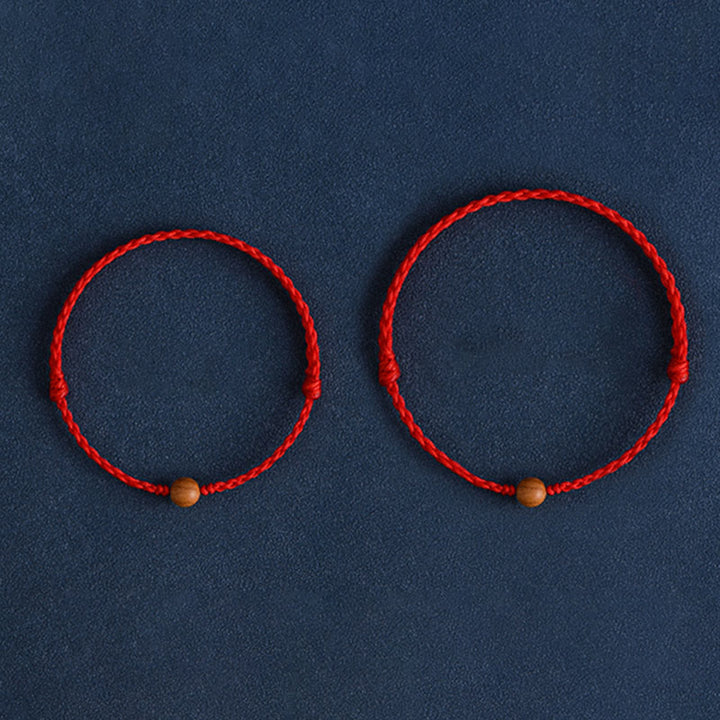 Pulsera trenzada con cuentas de madera de melocotón natural y Buddha Stones que alejan a los malos espíritus