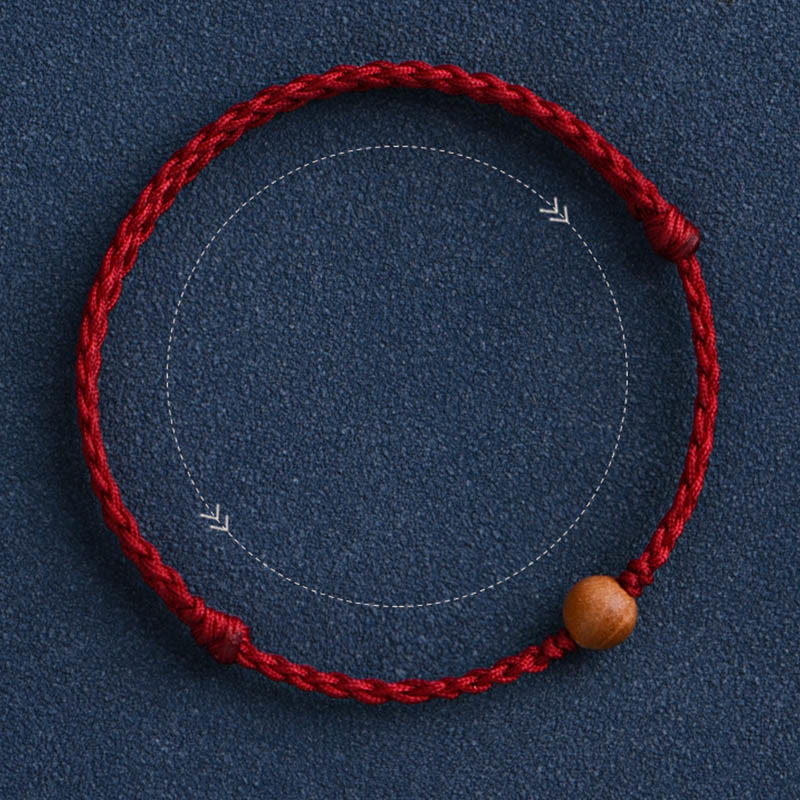 Pulsera trenzada con cuentas de madera de melocotón natural y Buddha Stones que alejan a los malos espíritus