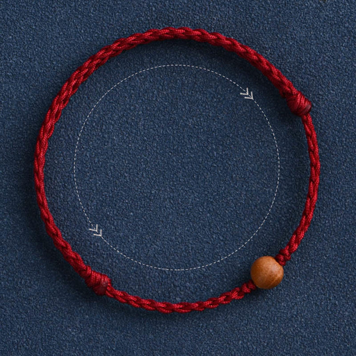 Pulsera trenzada con cuentas de madera de melocotón natural y Buddha Stones que alejan a los malos espíritus