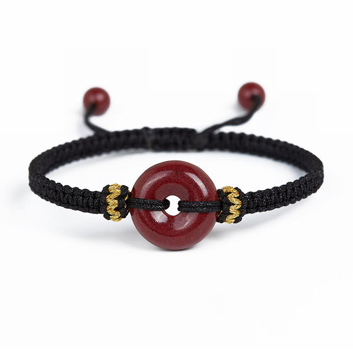 Pulsera trenzada de concentración con hebilla de paz redonda de cinabrio hecha a mano con Buddha Stones