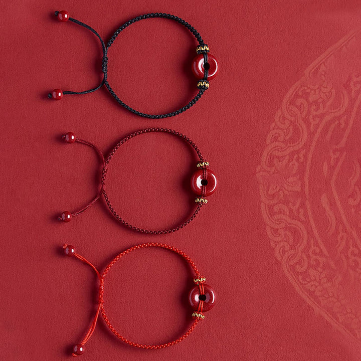 Pulsera trenzada de concentración con hebilla de paz redonda de cinabrio hecha a mano con Buddha Stones
