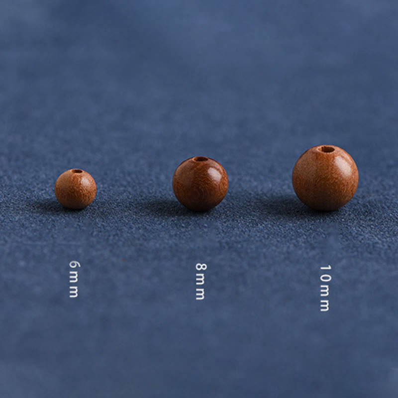 Pulsera trenzada con cuentas de madera de melocotón natural y Buddha Stones que alejan a los malos espíritus