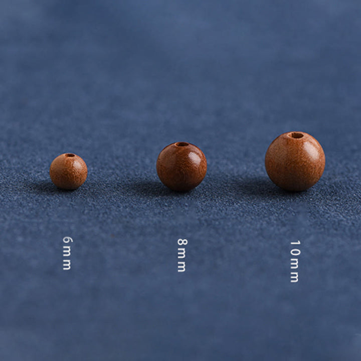 Pulsera trenzada con cuentas de madera de melocotón natural y Buddha Stones que alejan a los malos espíritus