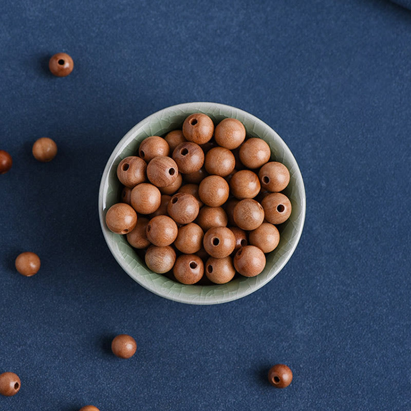 Pulsera trenzada con cuentas de madera de melocotón natural y Buddha Stones que alejan a los malos espíritus