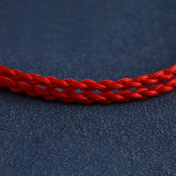 Pulsera trenzada con cuentas de madera de melocotón natural y Buddha Stones que alejan a los malos espíritus