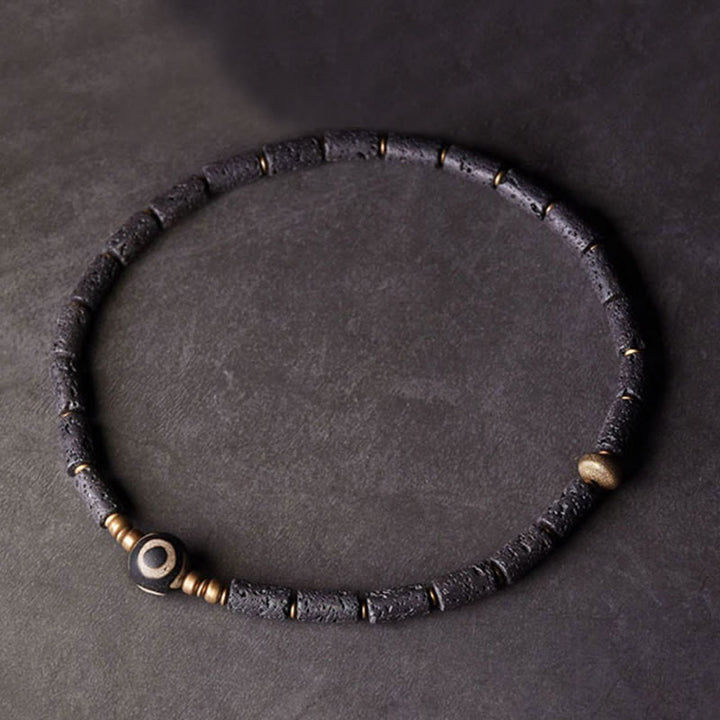 Pulsera de calma con múltiples vueltas de latón y cobre con cuentas Dzi de tres ojos y piedra de lava vintage de Buddha Stones
