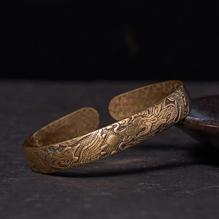 Pulsera de protección de la suerte de latón y cobre tallada con Buddha Stones, dragón y fénix jugando con una perla