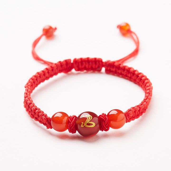 Pulsera trenzada de hilo rojo con ágata roja natural del zodíaco chino y Buddha Stones
