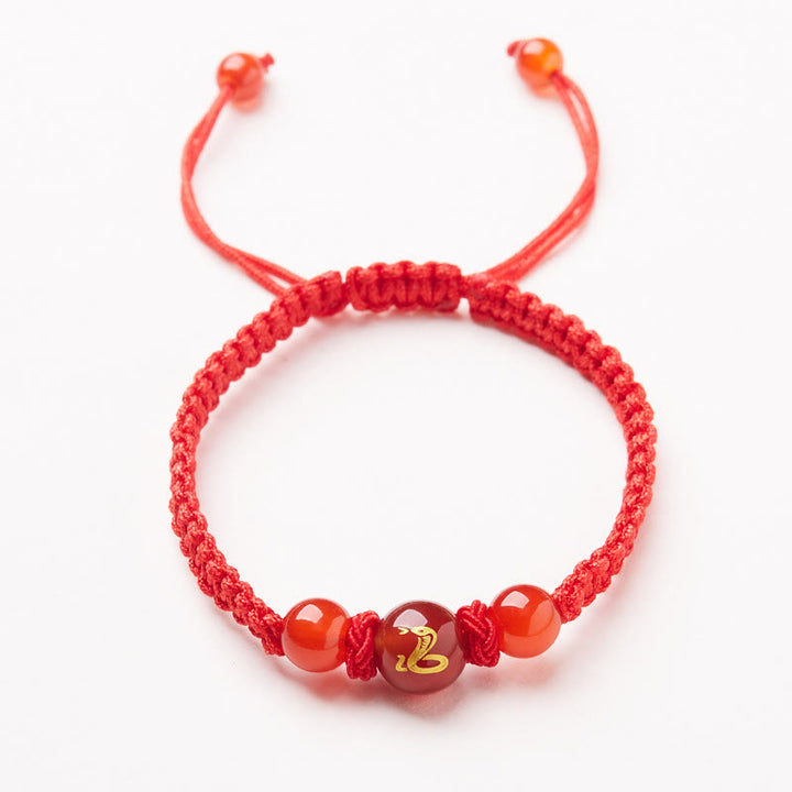 Pulsera trenzada de hilo rojo con ágata roja natural del zodíaco chino y Buddha Stones