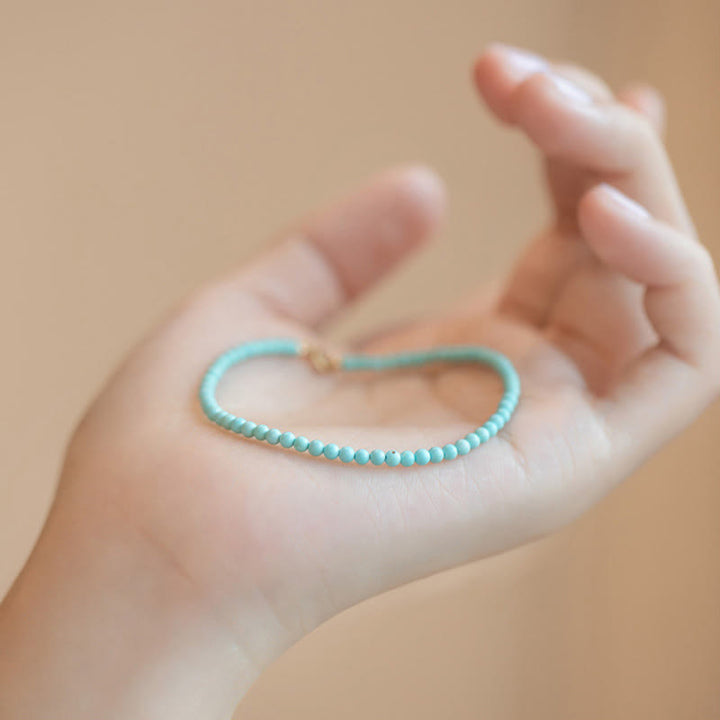 Pulsera de la sabiduría de cobre bañada en oro de 14 k con cuentas ultrafinas de turquesa de 2 mm y Buddha Stones