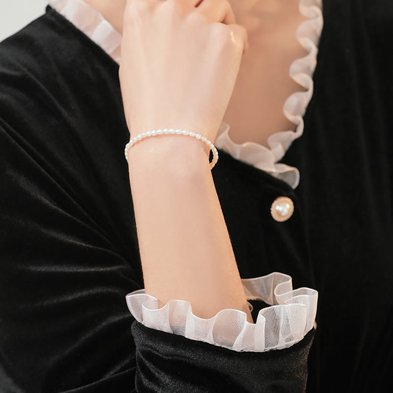 Pulsera de la sabiduría de cobre bañada en oro de 14 k con perlas naturales ultrafinas de 2 mm y Buddha Stones