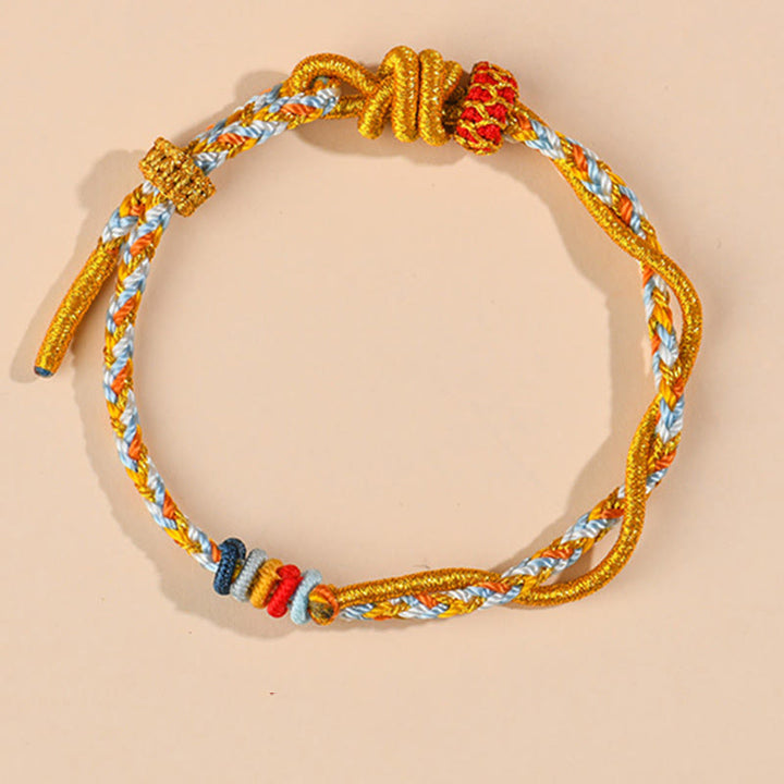 Pulsera de la suerte del año de la serpiente con serpiente y dragón de hilo colorido de Buddha Stones