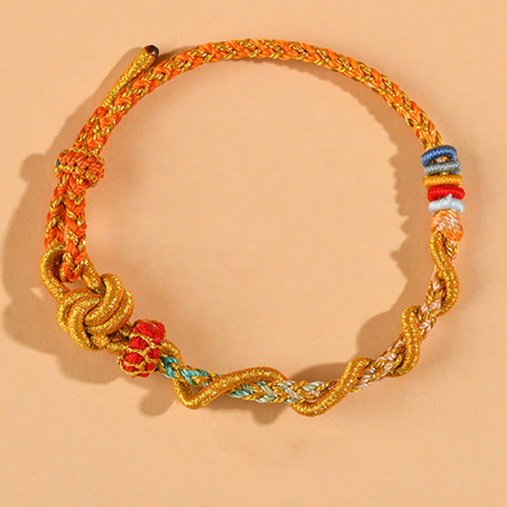 Pulsera de la suerte del año de la serpiente con serpiente y dragón de hilo colorido de Buddha Stones