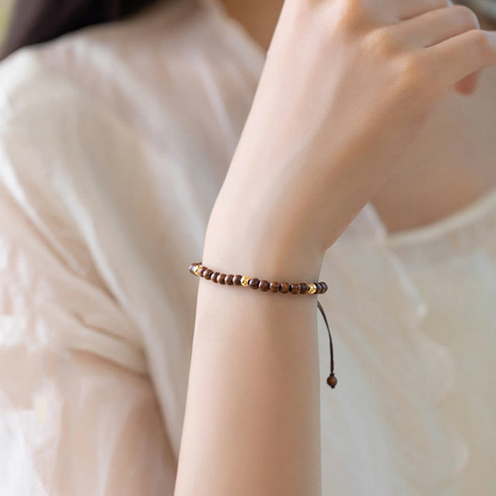 Pulsera protectora con cuentas de cobre bañadas en oro de 14 quilates y sándalo ultrafinas de 4 mm y Buddha Stones