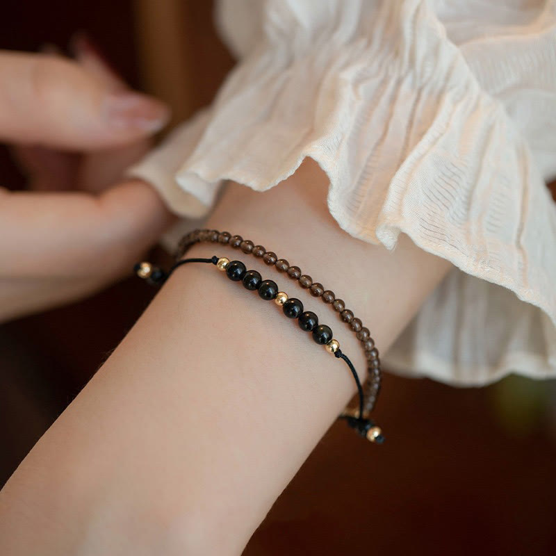 Pulsera de éxito con cuentas ultrafinas de obsidiana negra y cuarzo ahumado de Buddha Stones