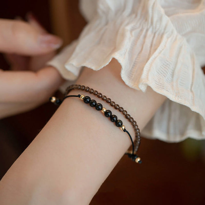 Pulsera de éxito con cuentas ultrafinas de obsidiana negra y cuarzo ahumado de Buddha Stones
