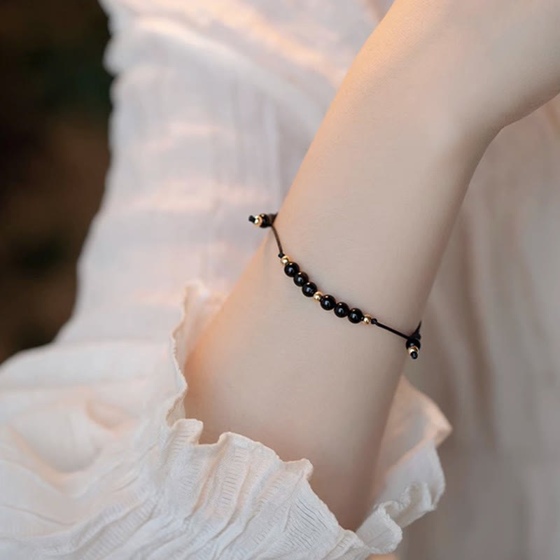 Pulsera de éxito con cuentas ultrafinas de obsidiana negra y cuarzo ahumado de Buddha Stones