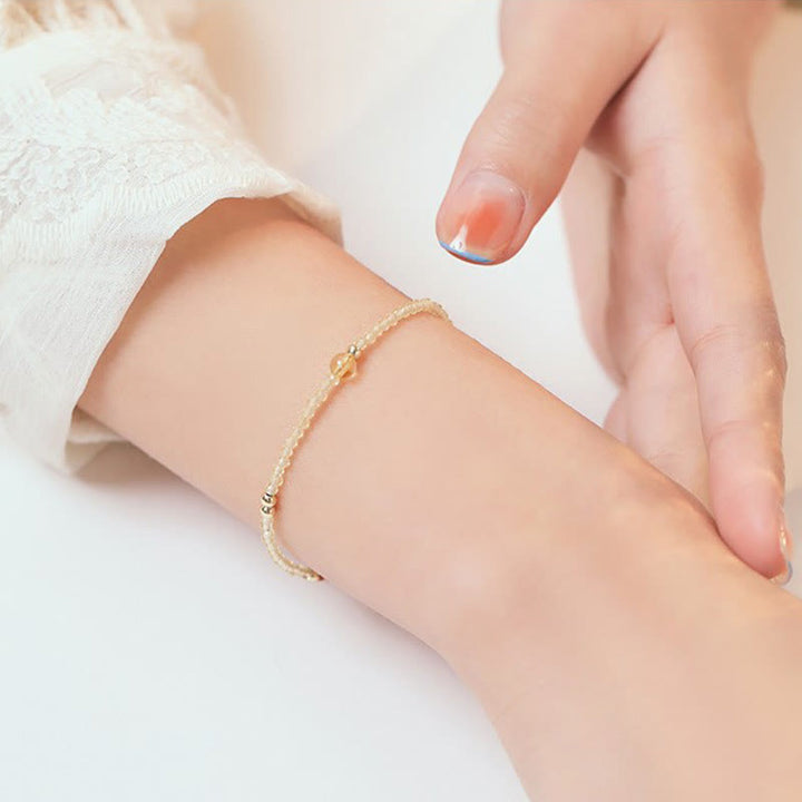 Pulsera protectora con cuentas de cobre bañadas en oro de 14 quilates y citrino ultrafinas de 2 mm de Buddha Stones