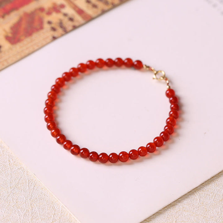 Pulsera de cuentas ultrafinas de ágata roja pequeña con Buddha Stones para calmar la mente