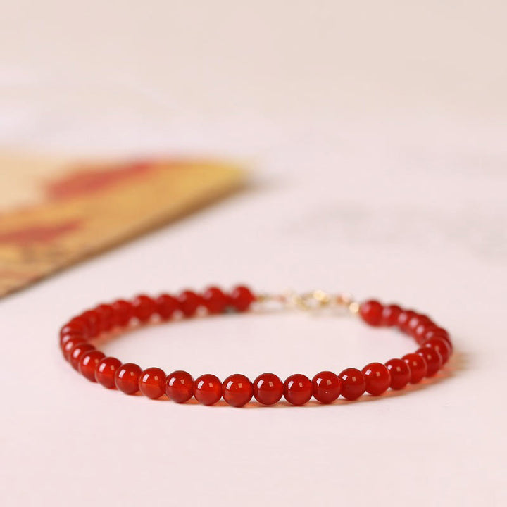 Pulsera de cuentas ultrafinas de ágata roja pequeña con Buddha Stones para calmar la mente