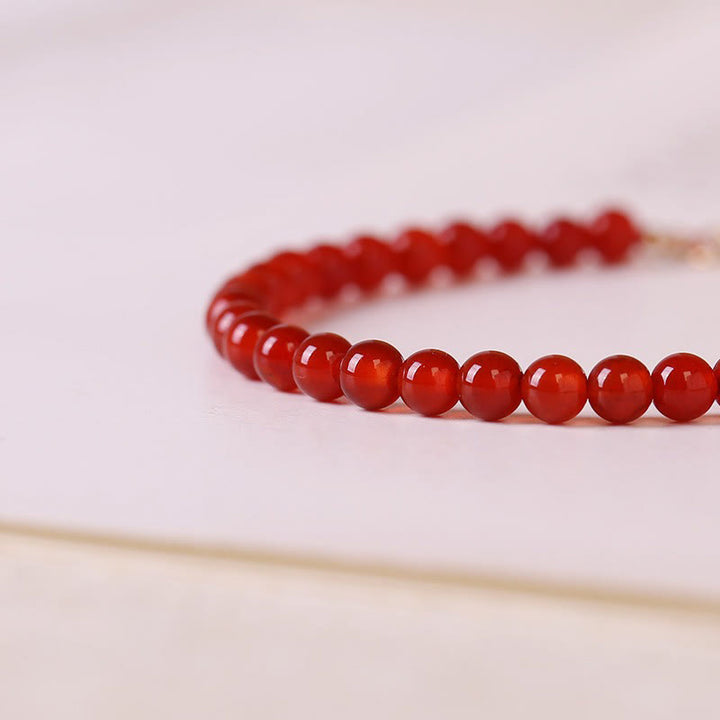 Pulsera de cuentas ultrafinas de ágata roja pequeña con Buddha Stones para calmar la mente