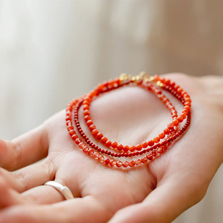 Pulsera de confianza con cuentas ultrafinas de ágata roja, cereza y caqui naturales de Buddha Stones