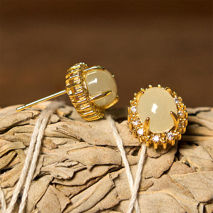 Pendientes de prosperidad de cobre con forma de huevo de jade hetiano natural y Buddha Stones