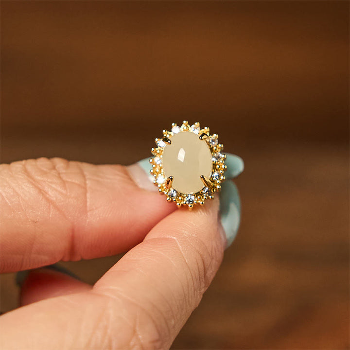 Pendientes de prosperidad de cobre con forma de huevo de jade hetiano natural y Buddha Stones