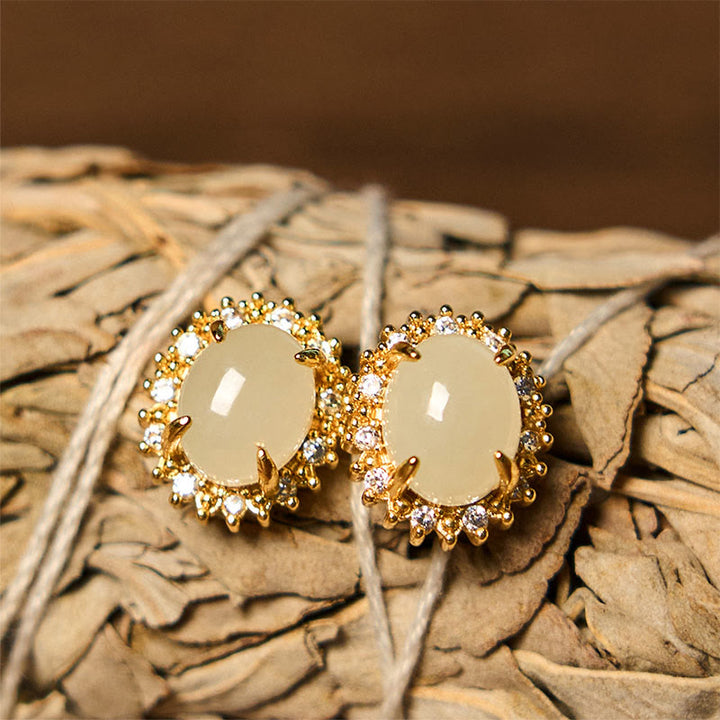 Pendientes de prosperidad de cobre con forma de huevo de jade hetiano natural y Buddha Stones