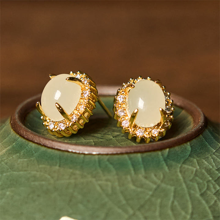 Pendientes de prosperidad de cobre con forma de huevo de jade hetiano natural y Buddha Stones