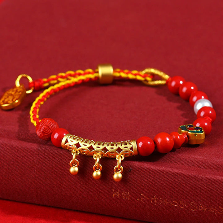 Pulsera de la calma de la marca Ruyi con campana de hilo rojo y cinabrio de Buddha Stones