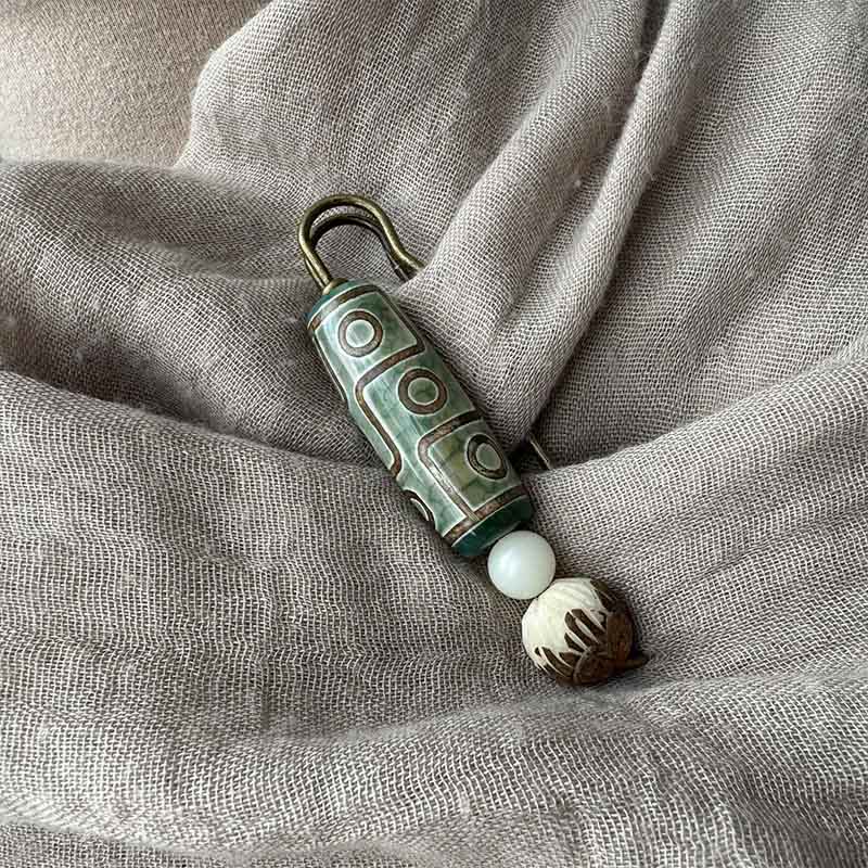 Broche protector de loto con semillas de Bodhi y cuentas Dzi de nueve Buddha Stones