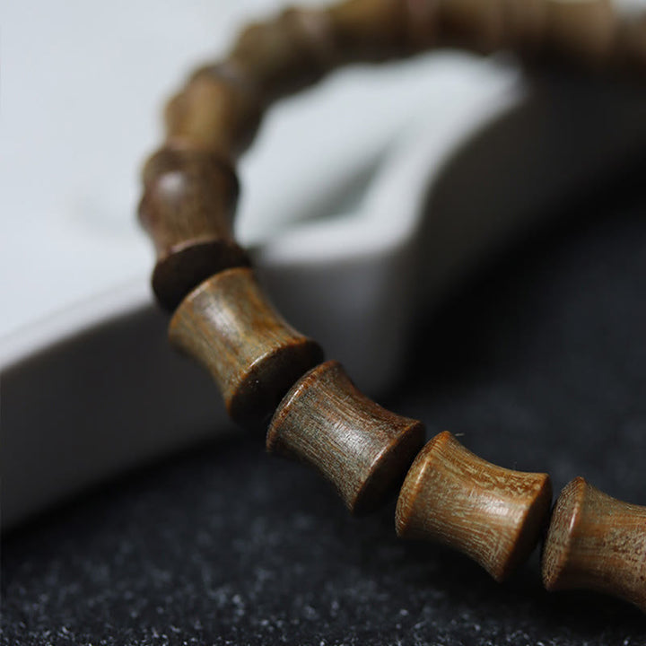 Pulsera de la paz de sándalo verde con cuentas Dzi tibetanas de nueve ojos y Buddha Stones