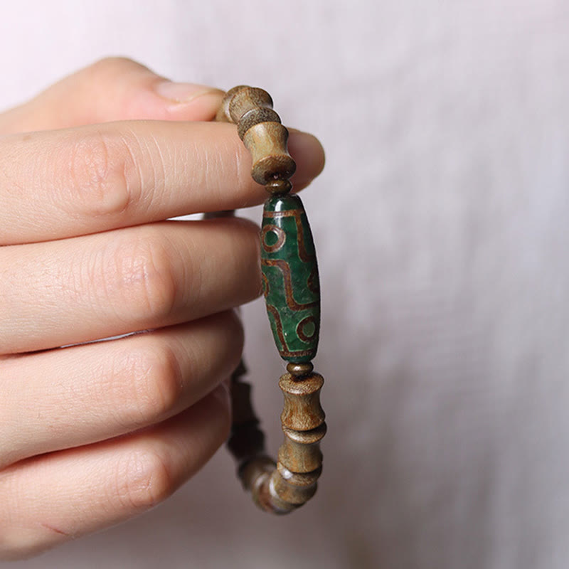Pulsera de la paz de sándalo verde con cuentas Dzi tibetanas de nueve ojos y Buddha Stones