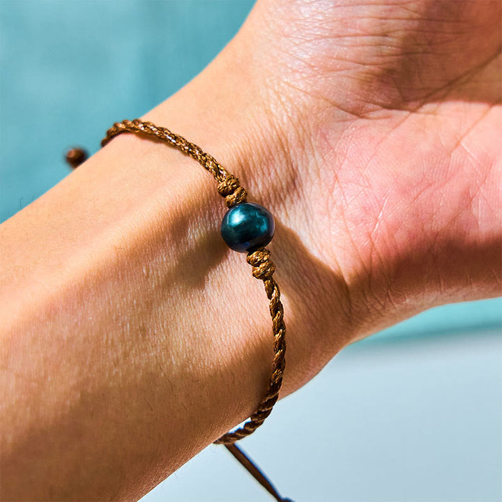 Pulsera de sabiduría con cuentas de cera y perlas negras de Tahití naturales de Buddha Stones
