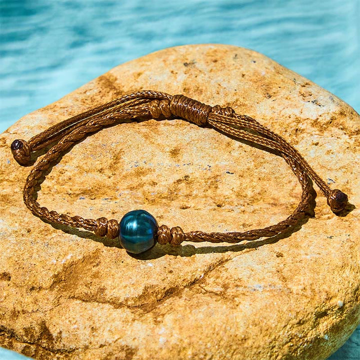 Pulsera de sabiduría con cuentas de cera y perlas negras de Tahití naturales de Buddha Stones