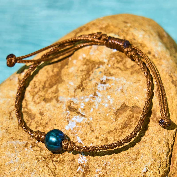 Pulsera de sabiduría con cuentas de cera y perlas negras de Tahití naturales de Buddha Stones