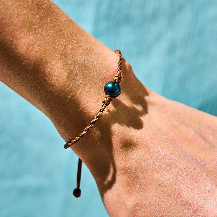 Pulsera de sabiduría con cuentas de cera y perlas negras de Tahití naturales de Buddha Stones