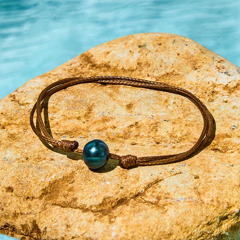 Pulsera curativa con cuerda de cera y cuentas de perla negra de Tahití naturales y Buddha Stones