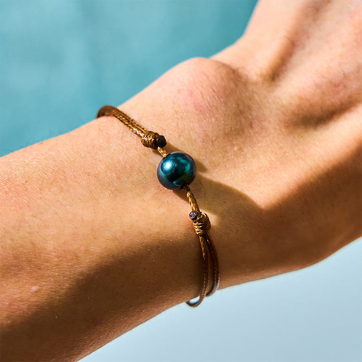 Pulsera curativa con cuerda de cera y cuentas de perla negra de Tahití naturales y Buddha Stones