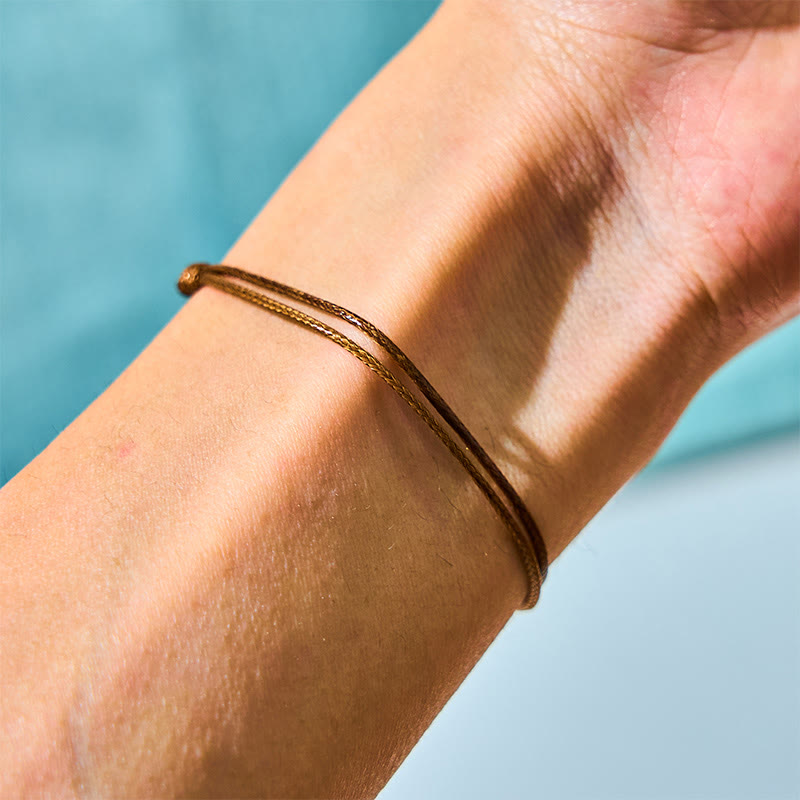 Pulsera curativa con cuerda de cera y cuentas de perla negra de Tahití naturales y Buddha Stones