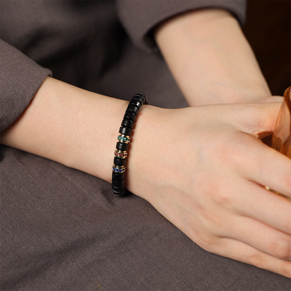 Pulsera de la paz con Buddha Stones, madera de ébano y sándalo rojo con hojas pequeñas y circonitas