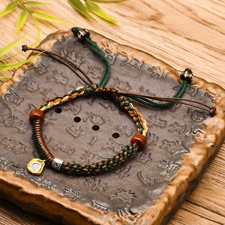 Pulsera trenzada de madera con protección de la diosa de la riqueza tibetana Zakiram hecha a mano con Buddha Stones