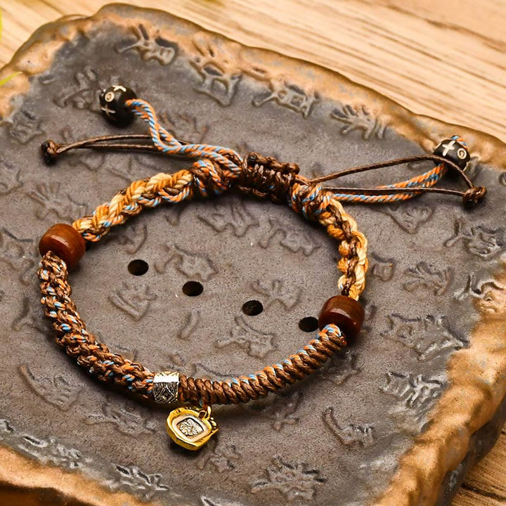 Pulsera trenzada de madera con protección de la diosa de la riqueza tibetana Zakiram hecha a mano con Buddha Stones