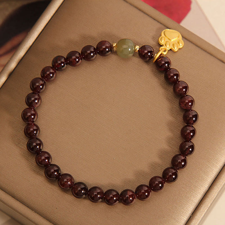 Pulsera purificadora de cuentas de jade hetian con granate y pata de gato de Buddha Stones